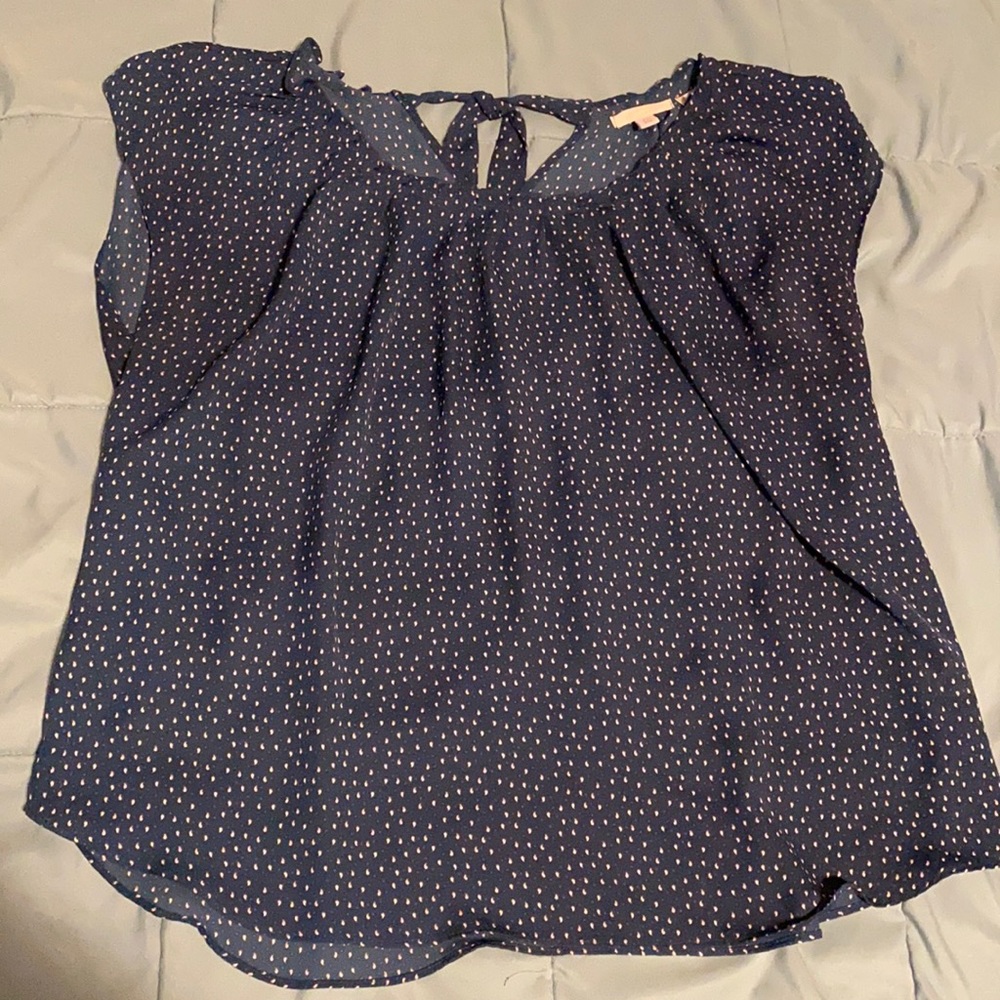 See through blouse with tie back.